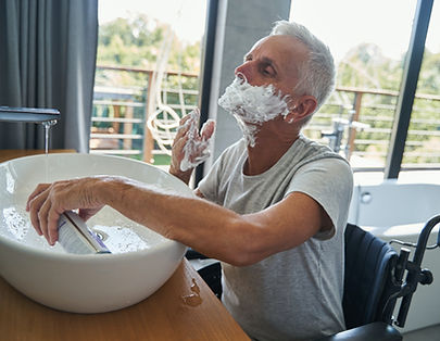 disabled-pensioner-applying-shaving-cream-on-his-face