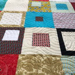 Modern squares quilt with circular pantograph