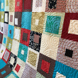 Modern squares quilt with circular pantograph