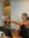 woman holding workout device in air