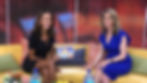 two woman smiling on couch