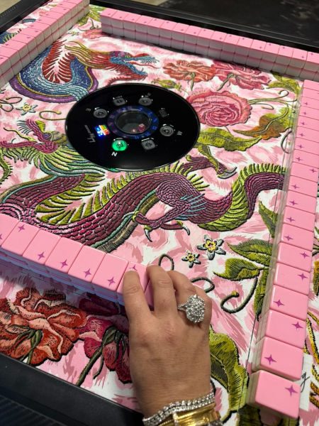 Missy Mahjong has an automatic mahjong table from Bespoke Mahjong.