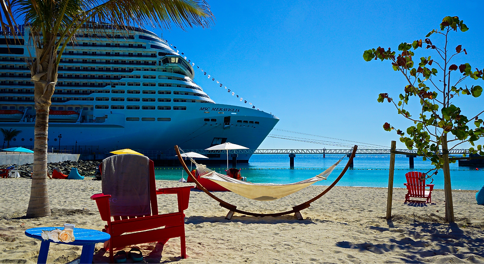 Beach scene with cruise ship, hammock, chairs and blue water Cruise Navigators.