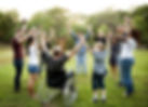 Group of people holding hands together in the park.jpg