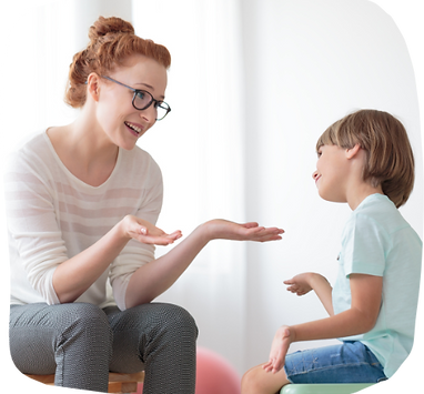 Therapist with young child talking