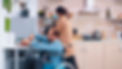 Man in wheelchair chopping vegetables with carer