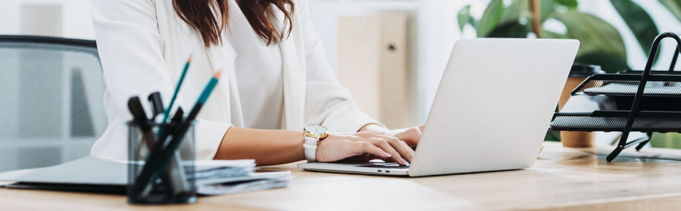 Close up image of business woman in white clothing.