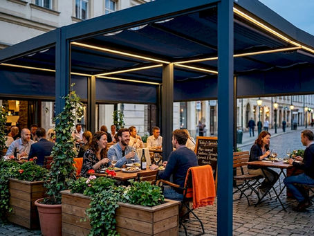 Outdoor restaurant seating under modern pergola in evening light