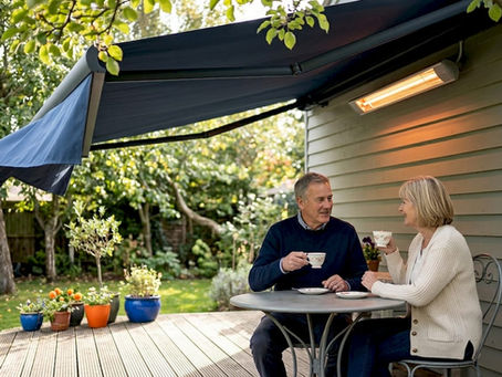 Couple under patio awning with heater