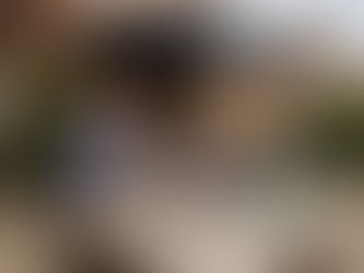 Couple relaxing under modern garden awning