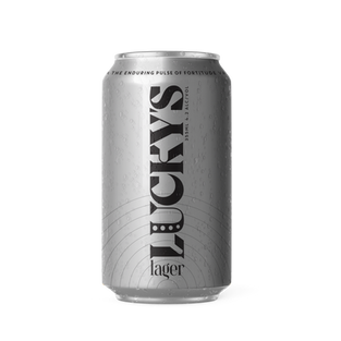 Image of silver beer can with faint black semi circles and the beer name "Lucky's Lager" running from base to the top of the can 