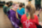 Two cubs chatting in a scout hut.