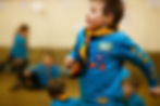 A beaver running in a scout hut.