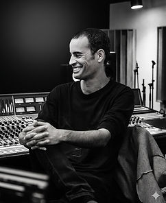 Hagai Davidoff in his recording studio, working at the mixing console
