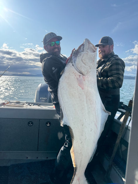 Person holding halibut catch