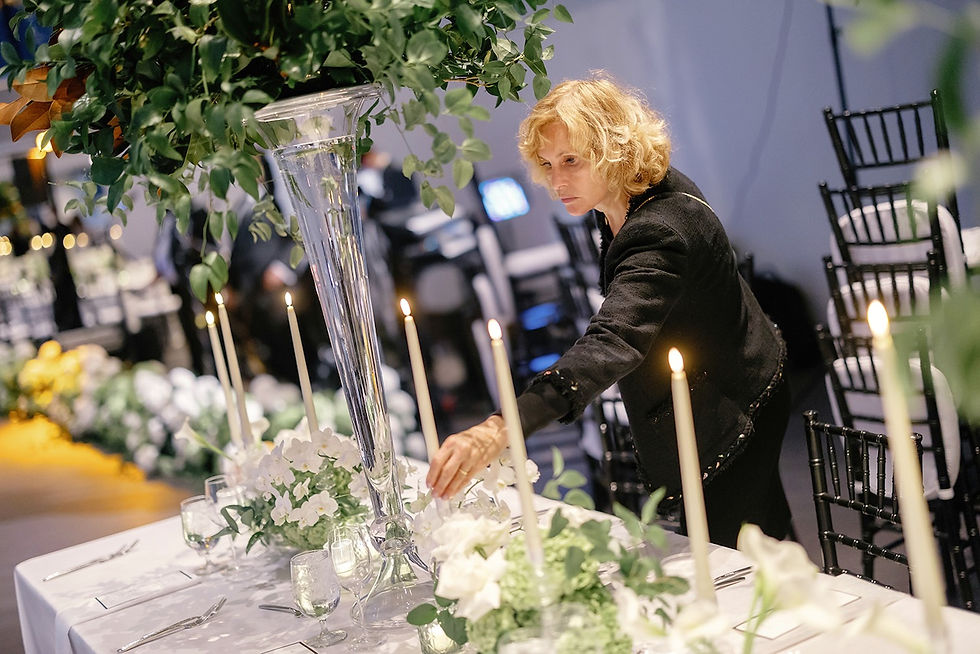 Luba Gankin of Primavera Dreams is setting up the table at the State Room, Boston.