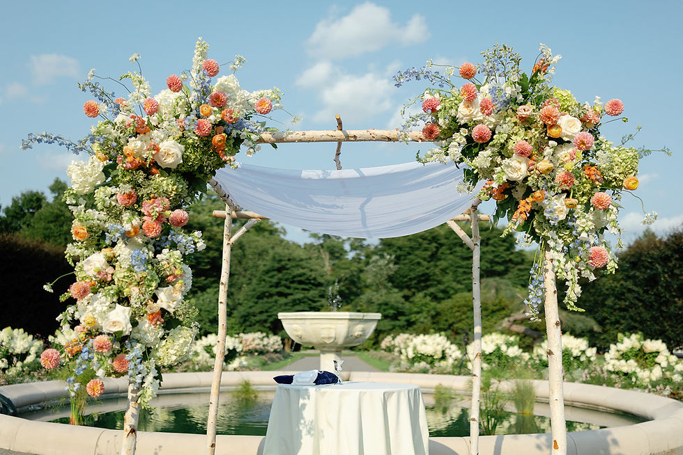 A floral chuppah in the Italianate Garden at Elm Bank
