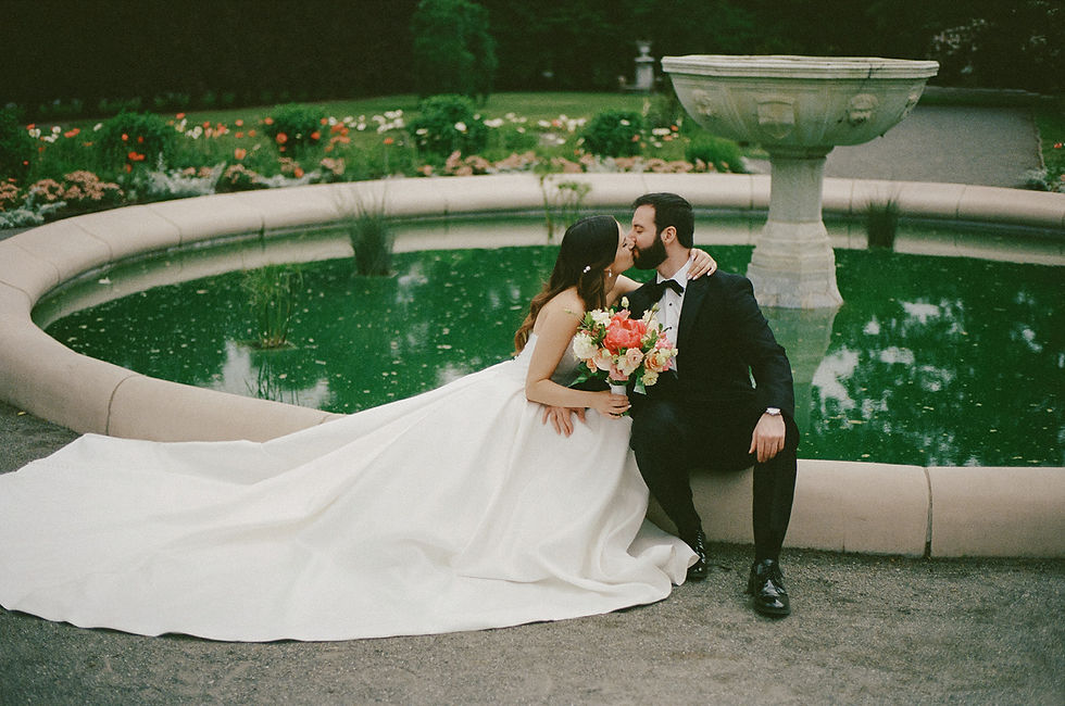 Brida and groom embracing in the Italianate Garden at Elm Bank