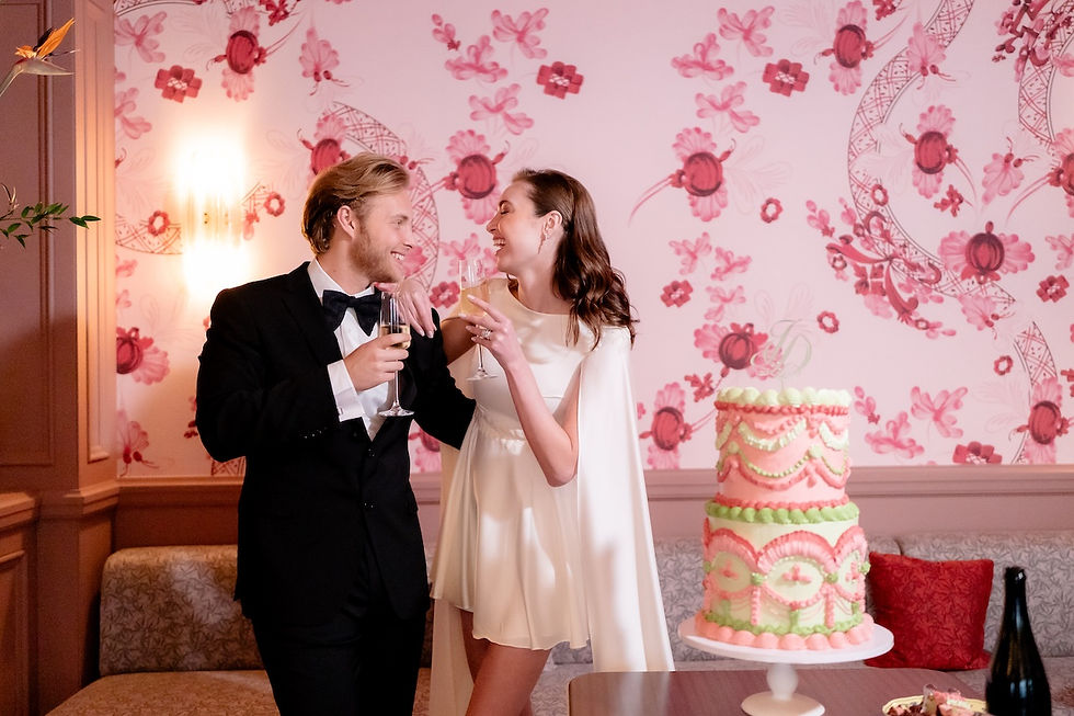 The bride and groom and the wedding cake at Cafe Ginori, Hotel De La Ville, Rome, Italy.