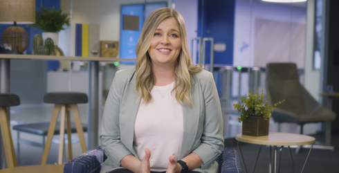 Smiling woman gesturing in a professional office