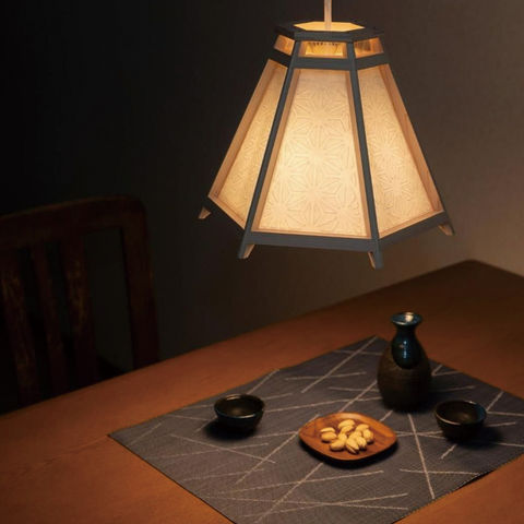 Kangetsu’ interior light inspired by Japan's moon-viewing culture, crafted with resin, wood, and washi using traditional kumiki techniques.