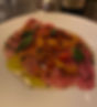 Tuna Carpaccio with Pickled Peppers & Lime Leaf.