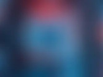 A futuristic computer motherboard with glowing red and blue lights, labeled "AM5," against a geometric, neon-patterned background.