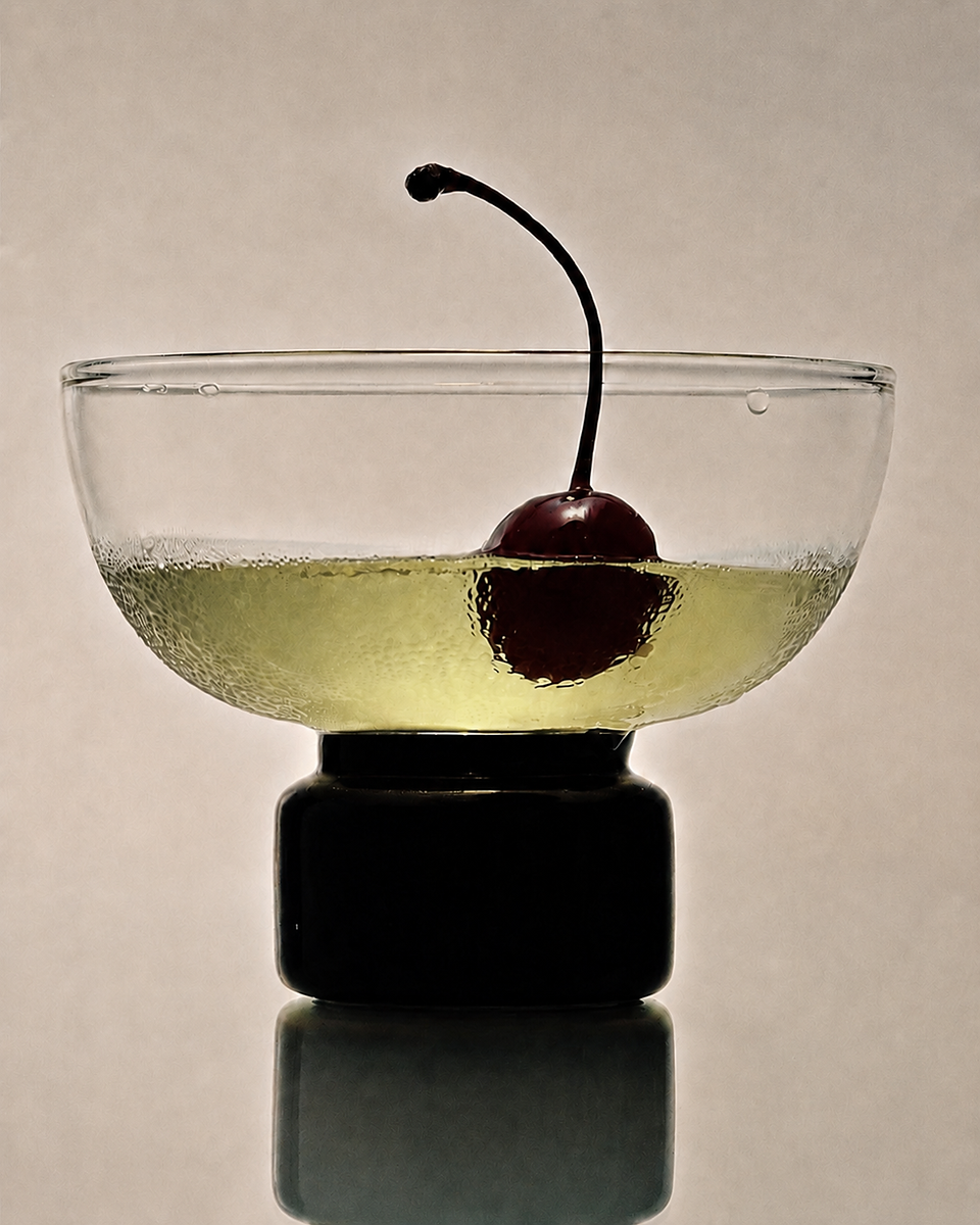 Elegant cocktail with cherry garnish showcasing elevated beverage presentation