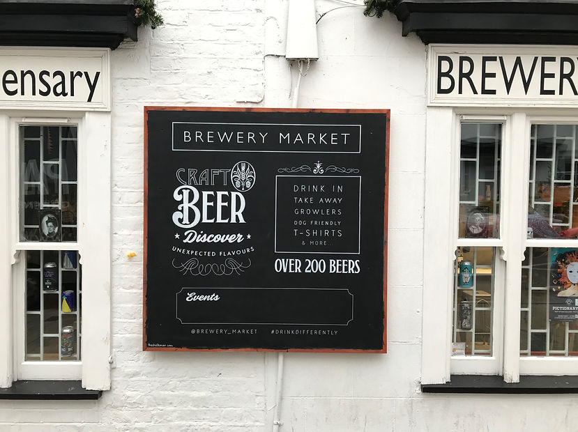 decorative hand drawn chalkboard in posca pen for outside pub