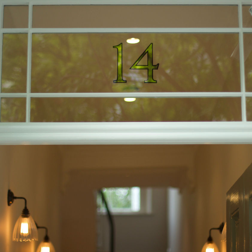 mirror gold leaf house number on glass window 