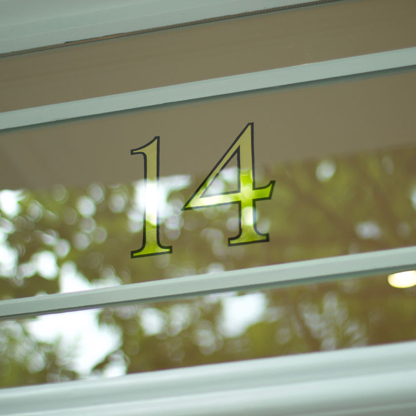 mirror gold leaf house number on glass window 