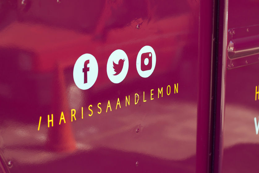 hand painted social media handles on harissa and lemon food truck