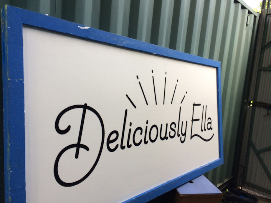 hand painted logo on wooden painted board