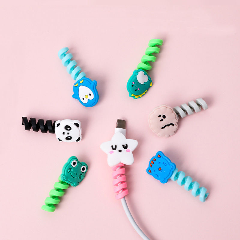 Miniatura: Protetor e organizador de cabos USB em espiral com desenho animado.