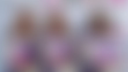 Three women in purple and white racing suits smile confidently. Background features logos: RS Team, Ladies Dakar, and Prima.