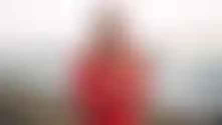 Chiara Bättig in a red suit, saying wella