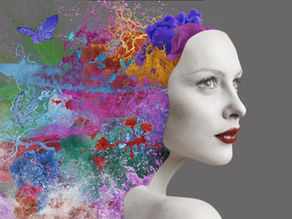 Vibrant colors and butterflies emerging from a woman’s head, representing emotional energy in motion