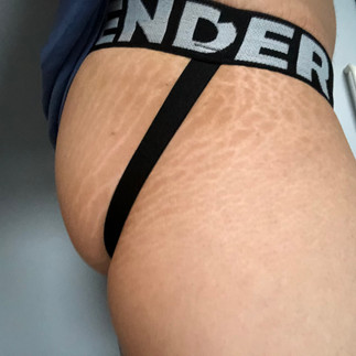 Wearing Gender Jockstrap with Xmall strapped down side view 2