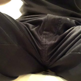 Packing with PG packer in cargo shorts, front view while sitting