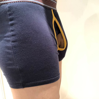 Packing with PG packer in boxers, side view showing packer in fly pouch