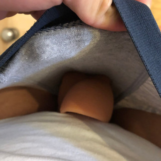 Packing with Mr X, top down view, peak inside boxers