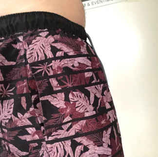 Packing in swim trunks, side view