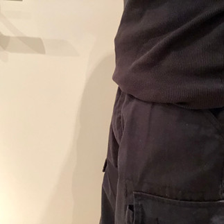 Packing with PG packer in cargo shorts, side view