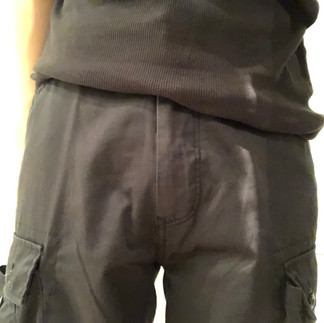 Packing with PG packer in cargo shorts, front view