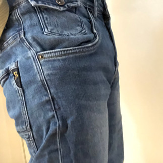 Packing with Mr X, side view in jeans