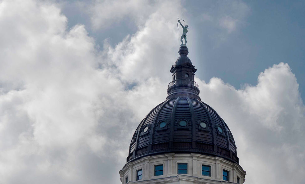 The Kansas Statehouse dome stands in front of billowing clouds on May 27, 2026. (Photo by Sherman Smith/Kansas Reflector)