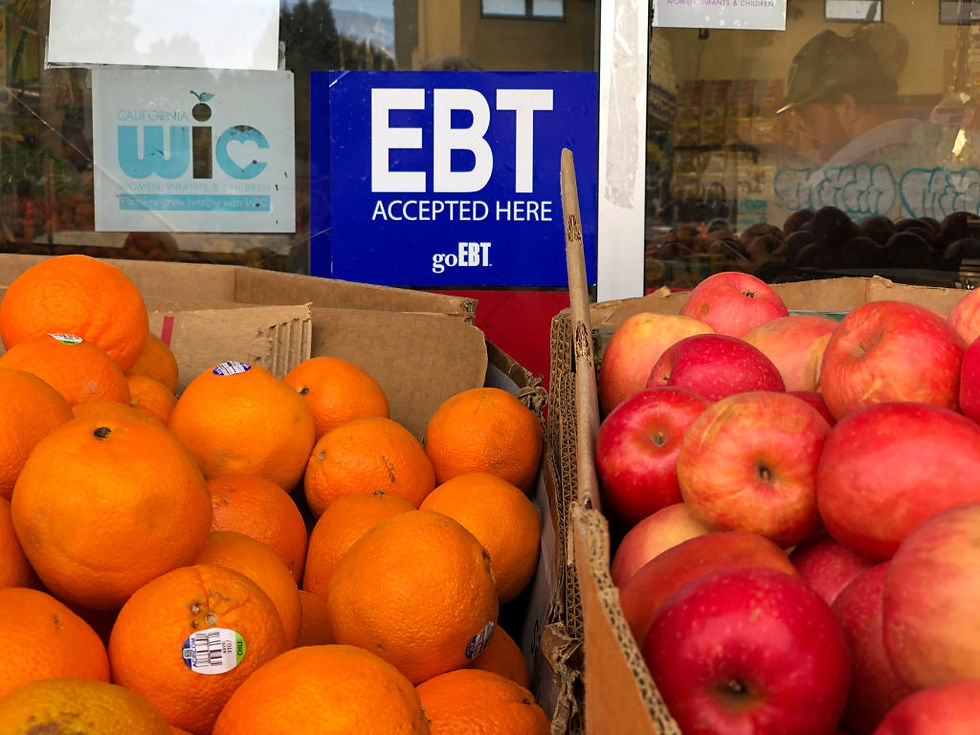 A sign noting the acceptance of electronic benefit transfer cards for food aid is displayed at a grocery store in California. Upcoming shifts in the federal food stamp program are poised to cost states billions of dollars, raising fears that more Americans will lose access to the nation’s largest food assistance program. (Photo by Justin Sullivan/Getty Images)