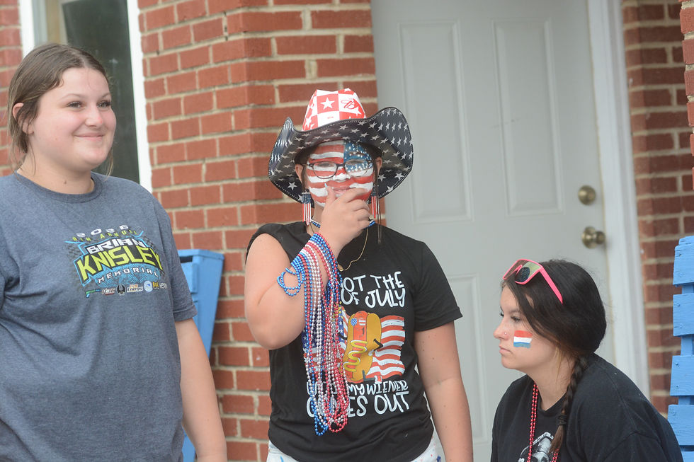 Emery Weers, center, goes all in on face-painting for the 250th birthday celebration. She was joined by friends Tatum Freeman, left, and Rory Cross.