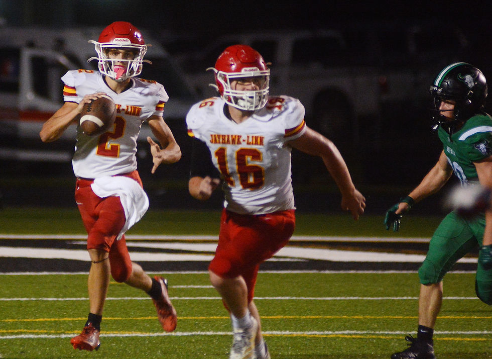 Jayhawk Trey Poole (16) provides interference for quarterback Londonn Burk.