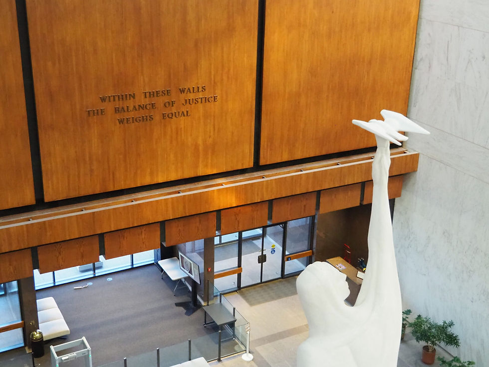 The Kansas Supreme Court building includes both a statue of justice and an inspiring motto. (Tim Carpenter/Kansas Reflector)